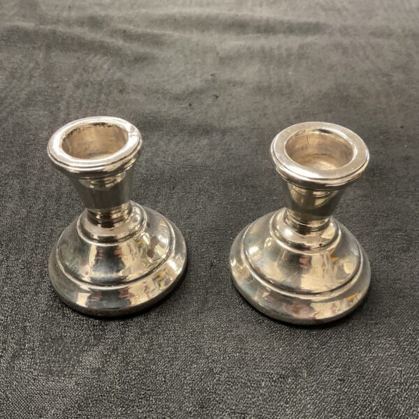 A pair of sterling silver hallmark candlesticks Birmingham maker S.M.4.485 ounces gross