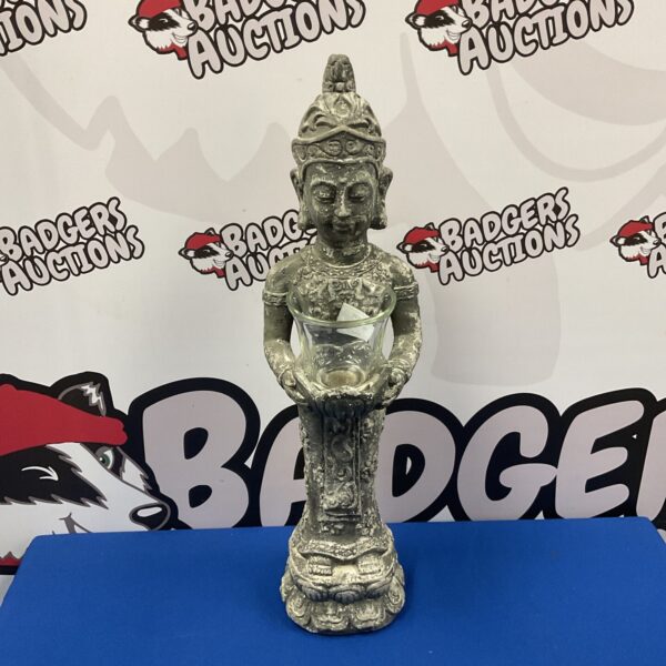 Detailed cast stone Buddha candle holder for home decor.