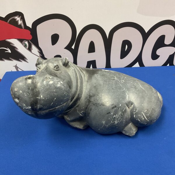 Large carved stone hippopotamus sculpture for garden or home decor.