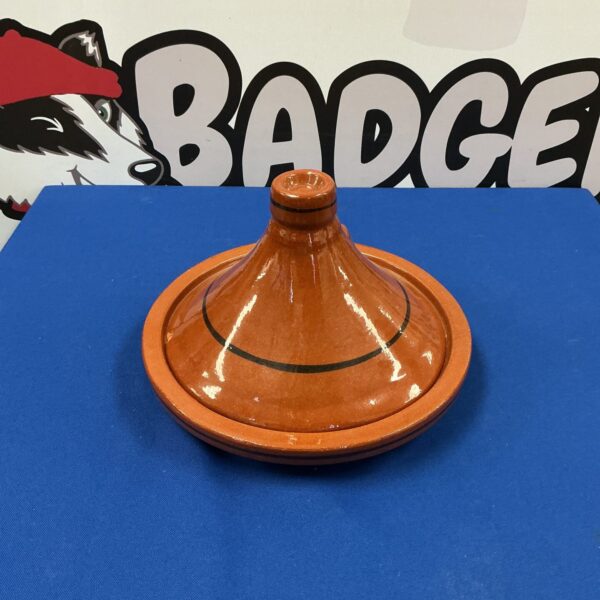 Large Moroccan tagine cooking pot for traditional stews.