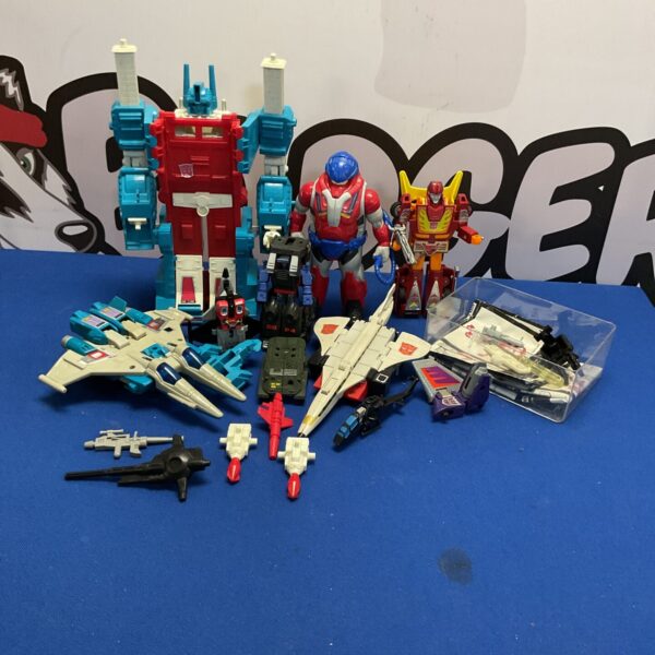 Vintage G1 Transformers lot with various transforming robots.