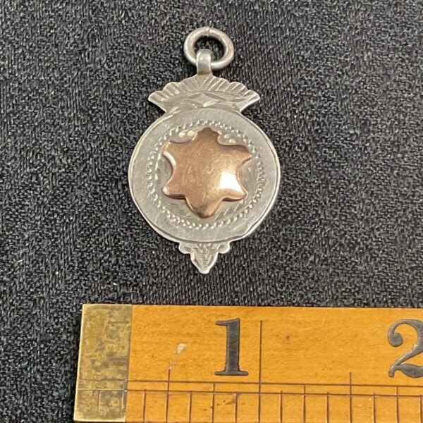 Vintage Birmingham hallmark fob medal with gold cartouche.