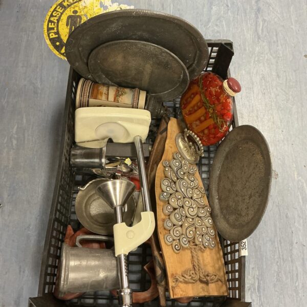 Mixed lot of vintage kitchenalia including pewter plates and juice press.