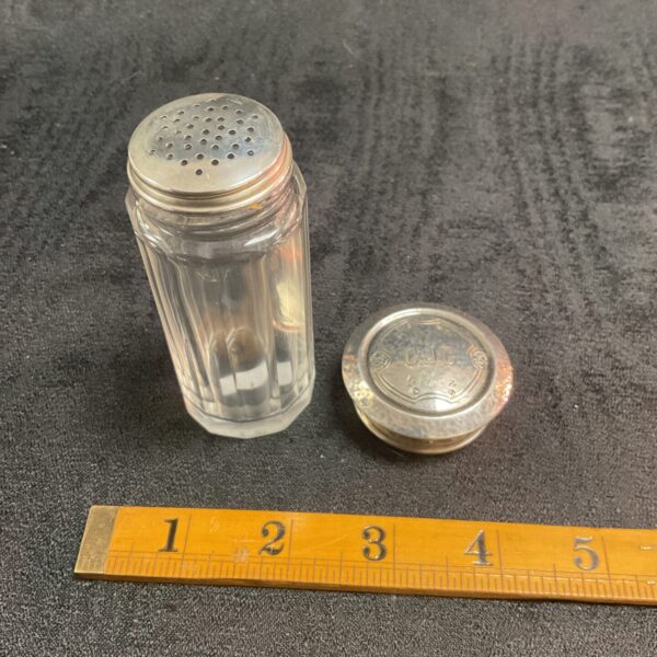 Vintage sterling silver shaker with hallmarked lid.