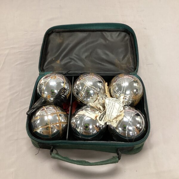 Vintage metal boules set in green canvas case.