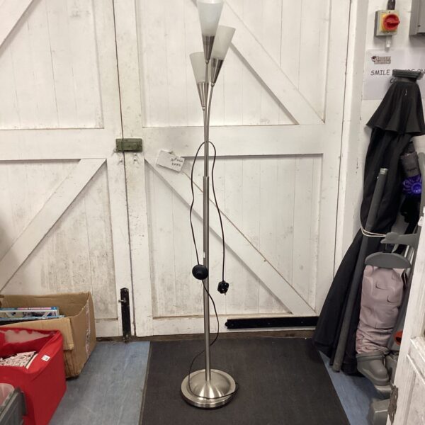 Chrome three-bulb uplighter floor lamp for modern interior lighting.