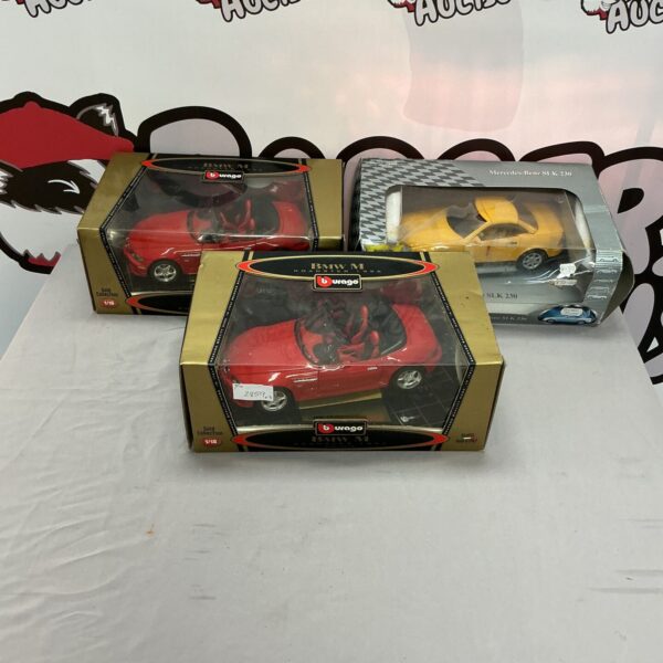 Boxed lot of BMW and Mercedes diecast model cars for collectors.