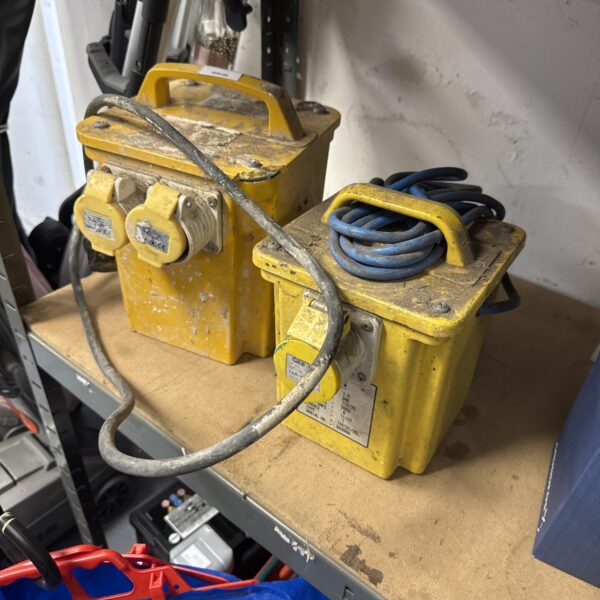 Yellow 110v transformer block with cable and sockets.