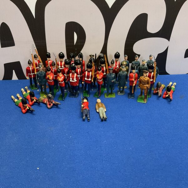 Group of vintage lead soldiers, collectible toy figures.