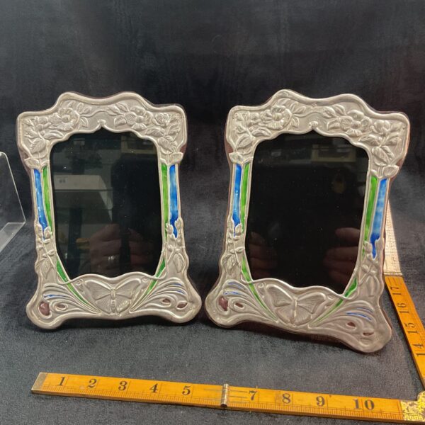 Pair of antique sterling silver Art Nouveau photo frames with butterfly design.