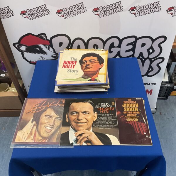Vintage vinyl record lot featuring Frank Sinatra, Elvis Presley, and Louis Armstrong.