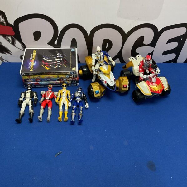 Power Rangers lot with figures, DVDs, and vehicles for collectors.