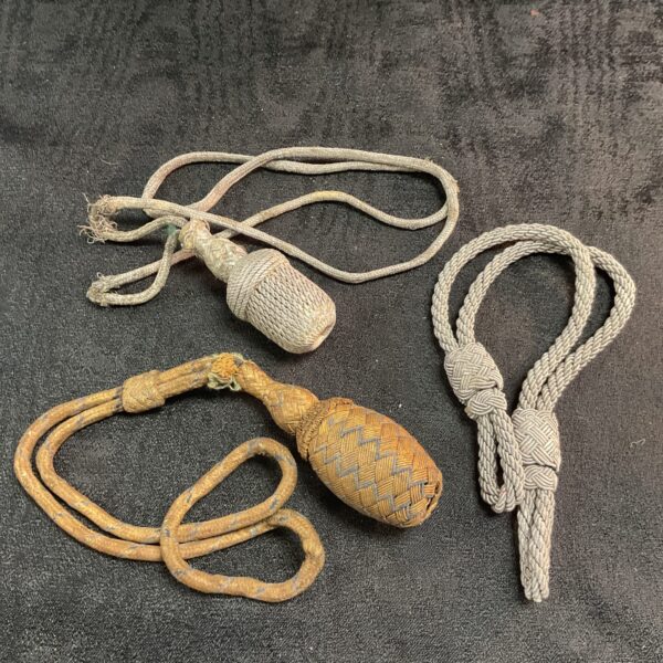 Vintage WW2 German dagger knots, detailed woven construction.
