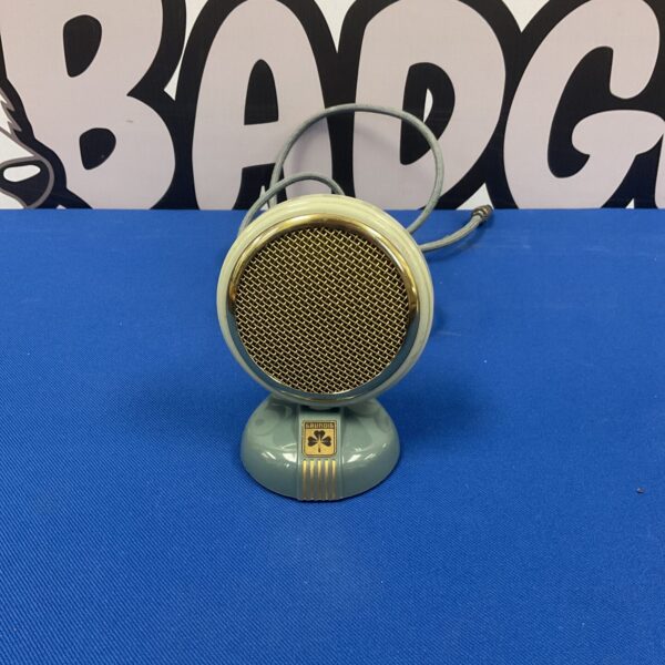 Vintage green Grundig condenser microphone, retro audio equipment.