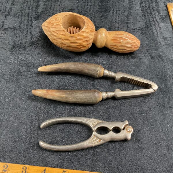 Three Nut Crackers inc carved wood cracker and horn handle