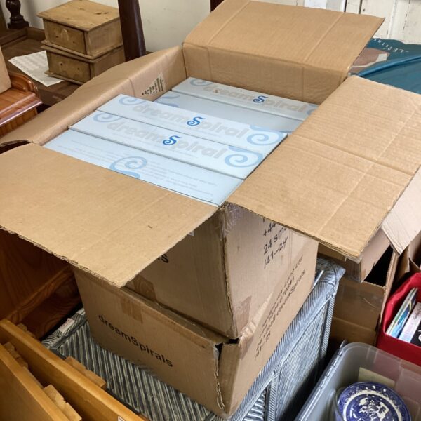 Two boxes of vintage dream spirals, collectible toy parts.