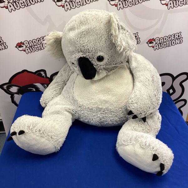 Large grey koala plush toy, front view.