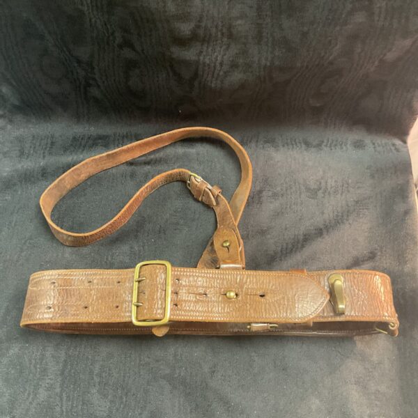 Detailed view of vintage WWI/WWII leather Sam Browne belt.