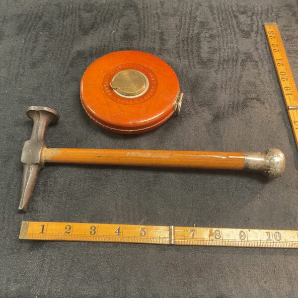 Antique John Rabone tape measure and hammer set with silver knop.