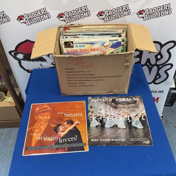 Vintage vinyl record lot featuring Frank Sinatra and Johann Strauss.