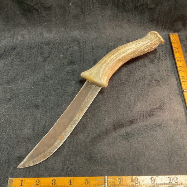 Vintage stag horn handle knife with steel blade.