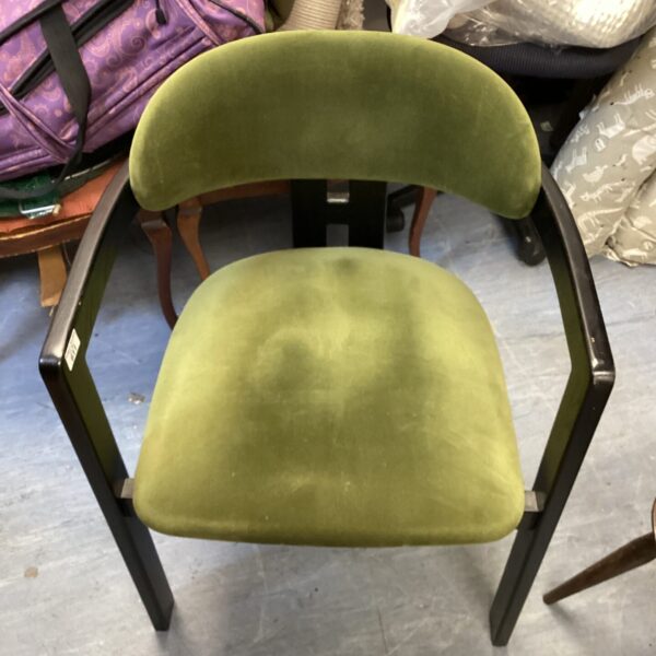 Vibrant green velvet Neo Art Deco chair with sculpted design.