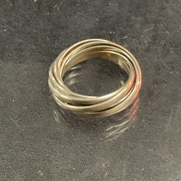 Close-up of intricate silver puzzle ring, size S.