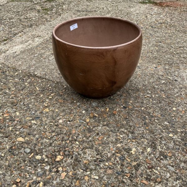 Large ceramic garden pot for outdoor plants and garden decor.