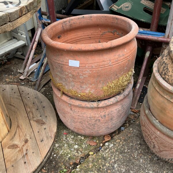 Pair of vintage terracotta plant pots for garden use.