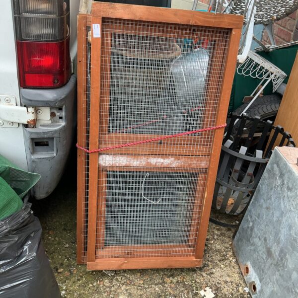 Small animal garden run with wire mesh and wooden frame.