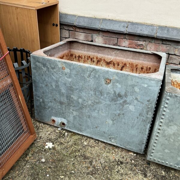 Large vintage galvanised water tank for garden or farm use.