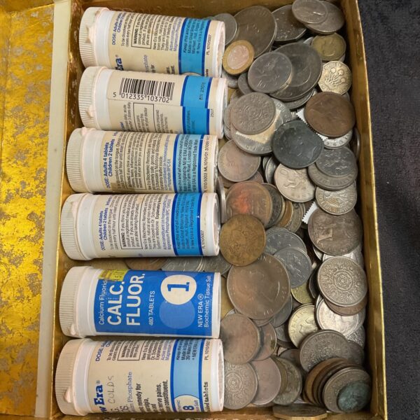 Mixed coin lot featuring Rhodesian coins and copper tubes.