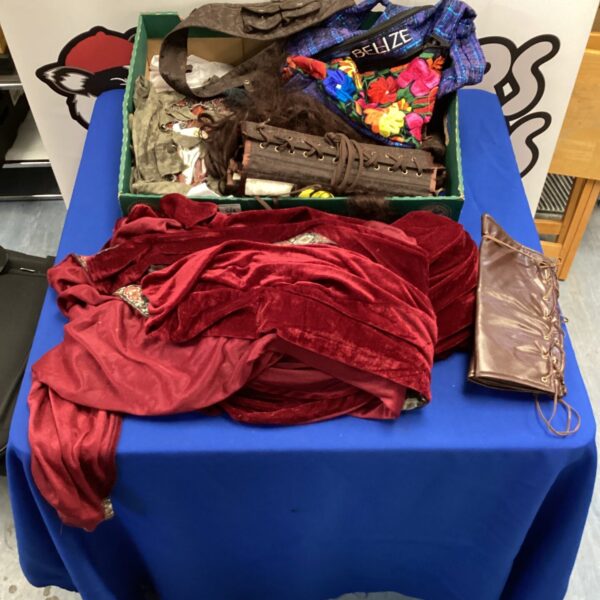 Box of fancy dress clothing inc wig, full length hooded cape & corsets
