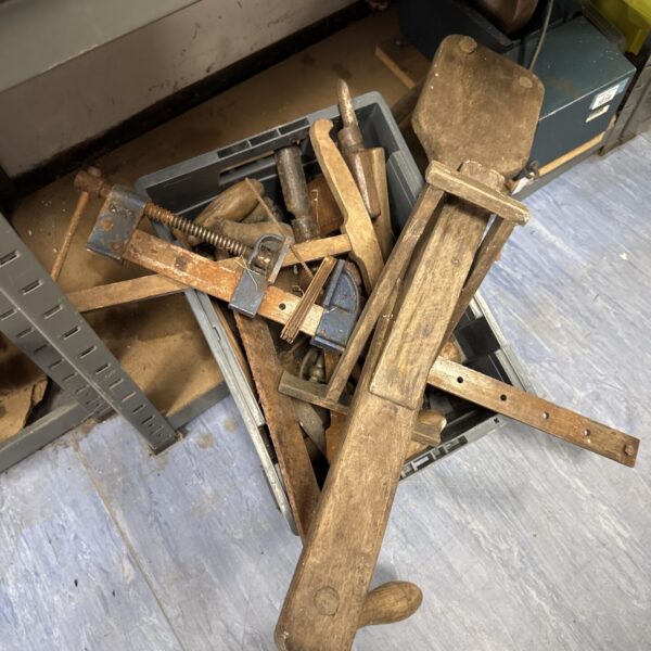 Vintage woodworking tools including hand planes in a box.