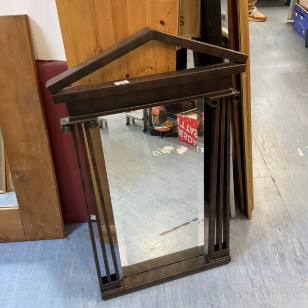 Vintage bevelled edge temple mirror with metal frame.