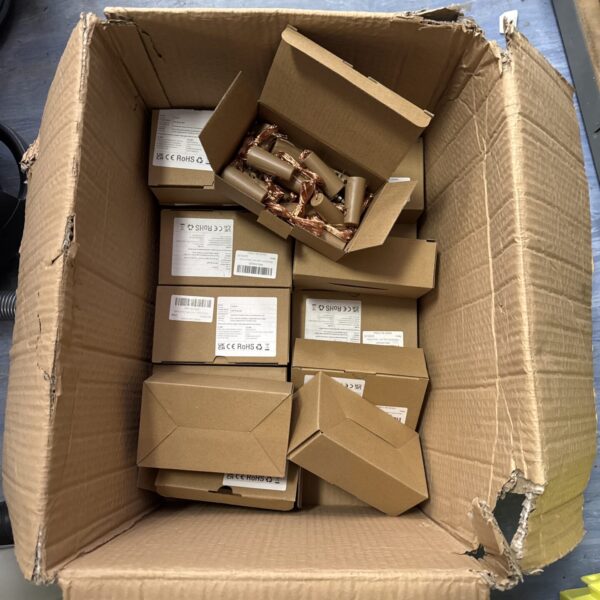 Quantity of wine bottle fairy lights in open boxes.