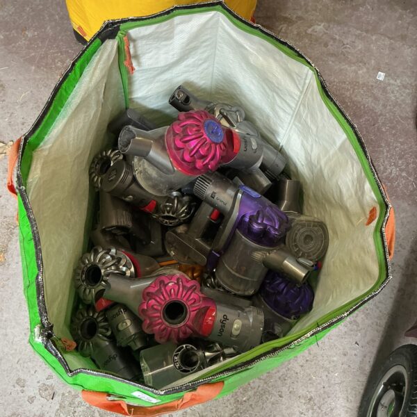 Lot of vintage Dyson vacuum cleaners awaiting restoration.