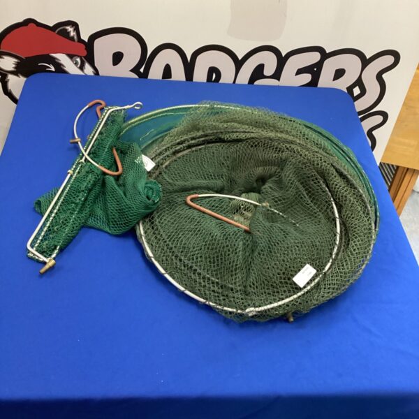 Bundle of green fishing nets for angling and outdoor use.