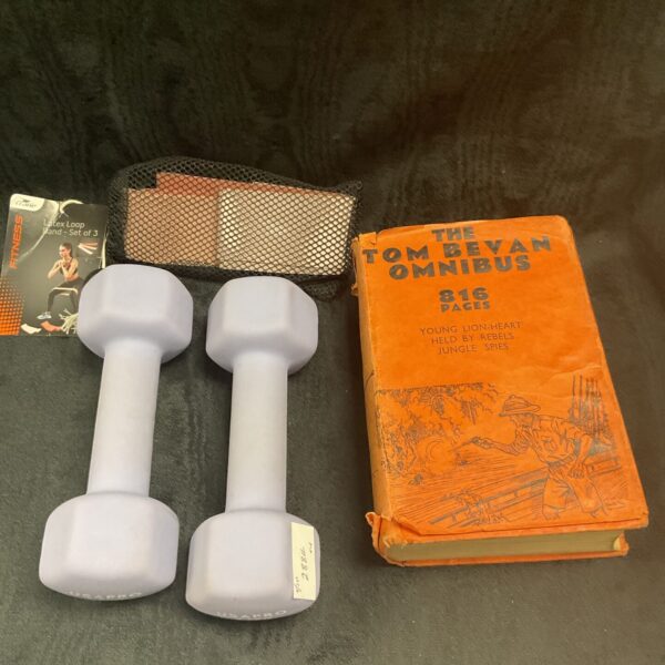 Tom Bevan Omnibus book with exercise weights and resistance bands.