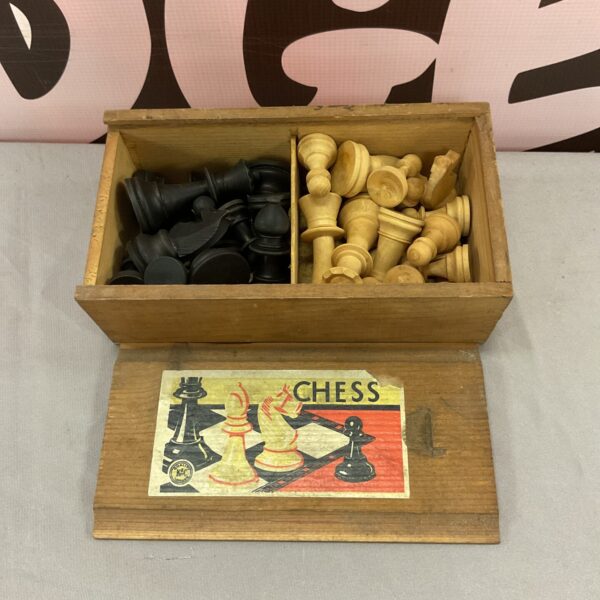 Vintage wooden chess set with pieces inside original box.