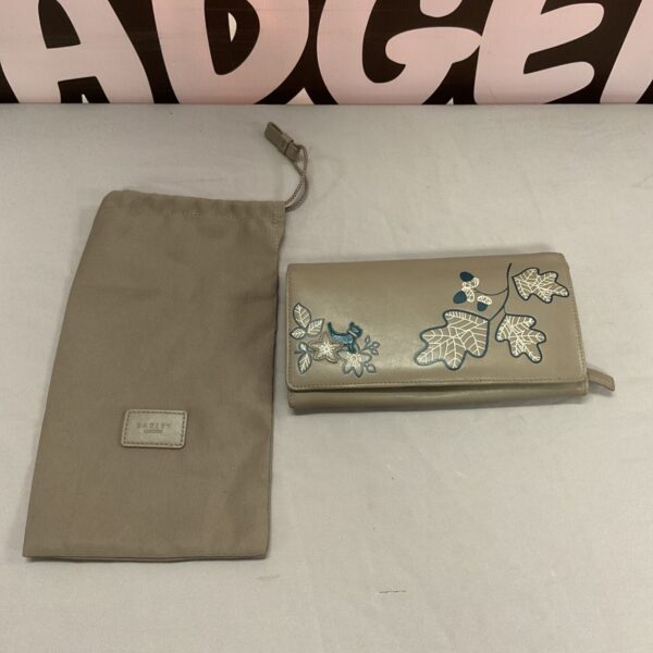 Grey leather Radley purse with floral design.