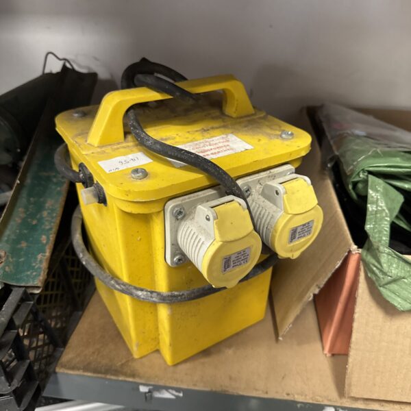 Yellow Carroll & Meynell 110v transformer block with two sockets.