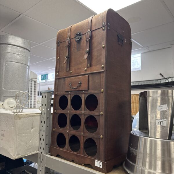 Vintage wooden bottle cabinet for drinks storage.