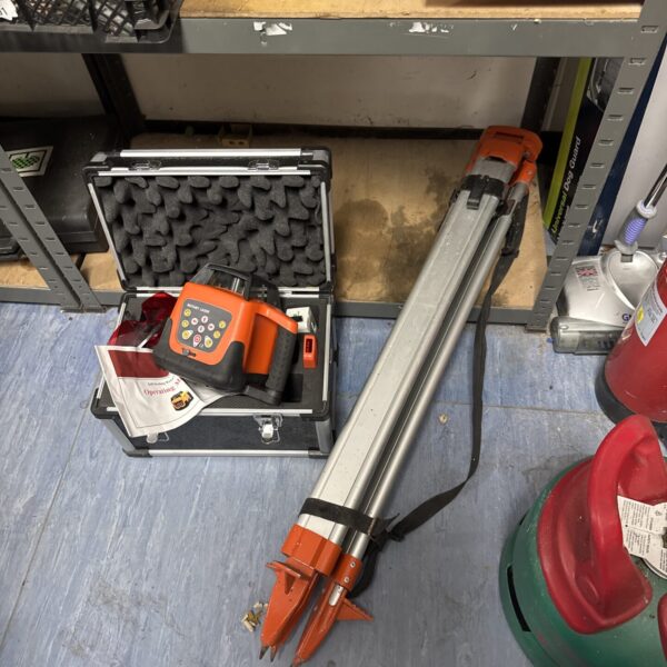 Used rotary laser level set with tripod and carrying case.