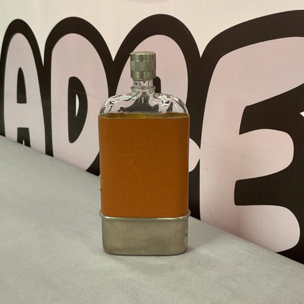 Vintage leather bound hip flask for spirits.