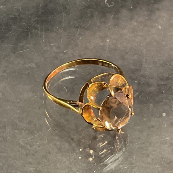 Elegant 9ct rose gold ring with a smokey quartz stone.
