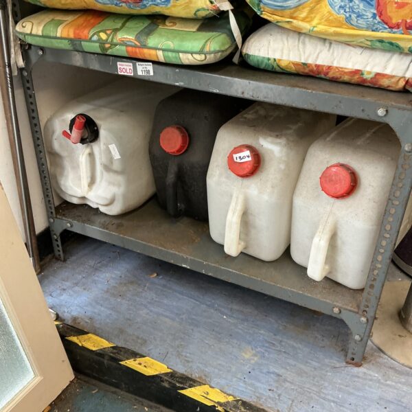 Lot of four plastic camping water containers for outdoor use.
