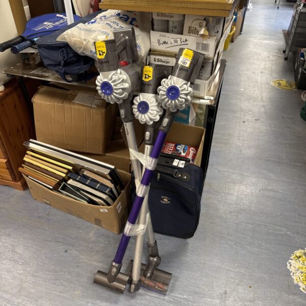 Bundle of Dyson cordless hoovers for cleaning and restoration.