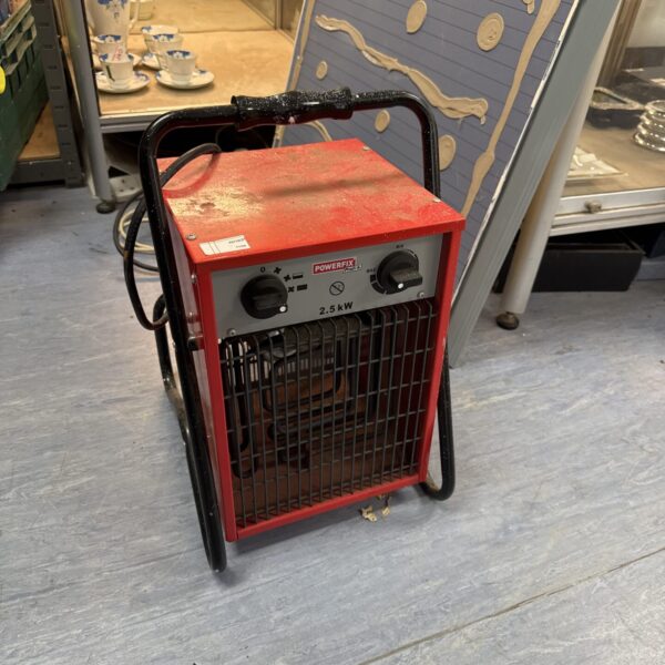 Red Profix profi+ 2.5kw space heater with dial control.