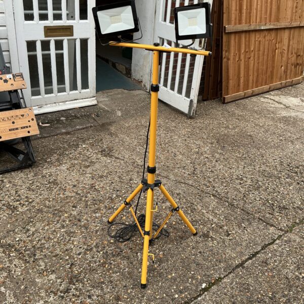 Portable LED site light on tripod stand.
